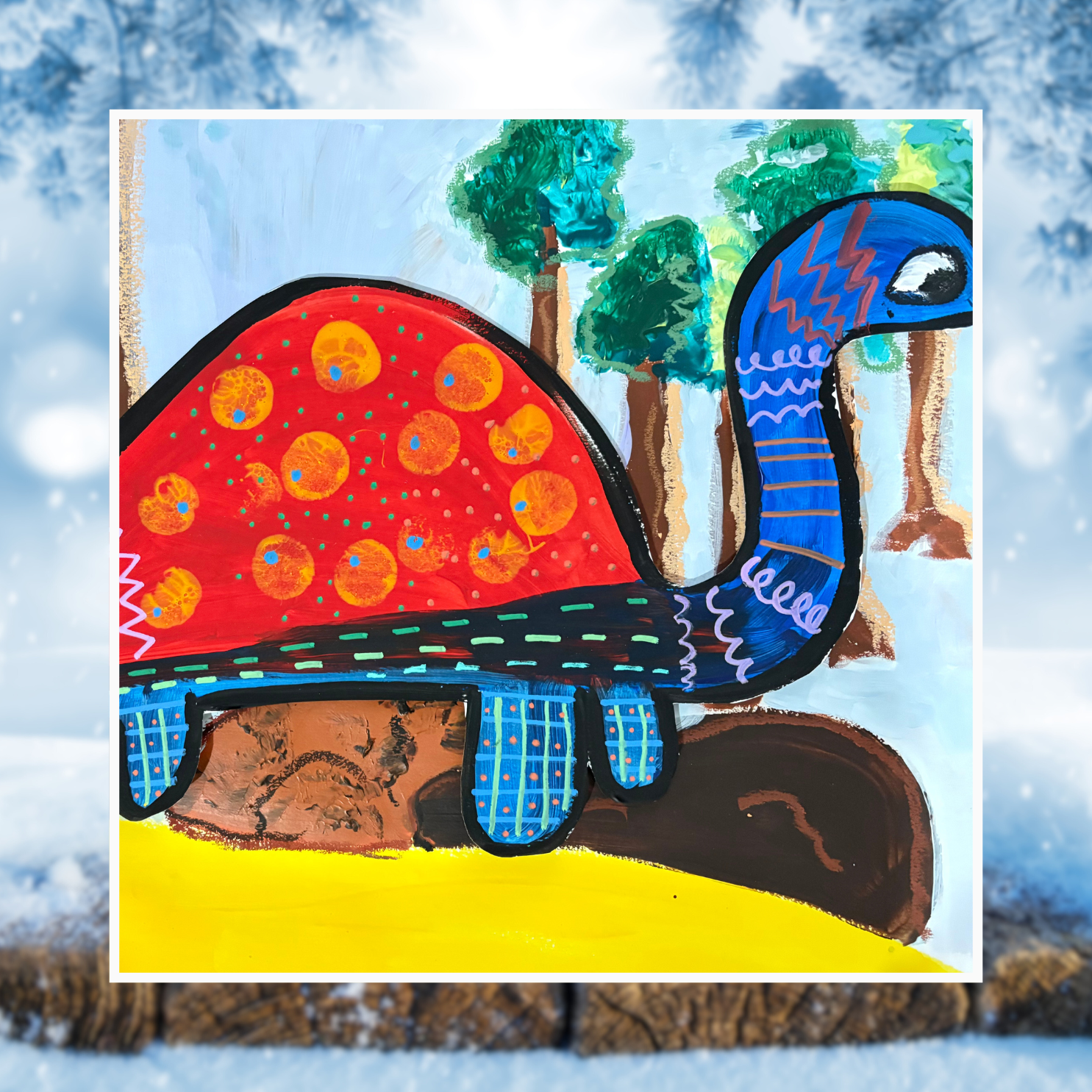 Pattern-o-saurus painted in red, blue with yellow sand and background trees